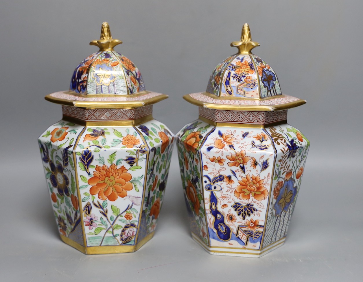 A pair of early 19th century Masons hexagonal ironstone jars and covers 24cm, impressed mark ‘Patent Ironstone China’ to covers only